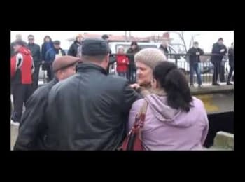 Crimean self-defence brutally treating an old lady