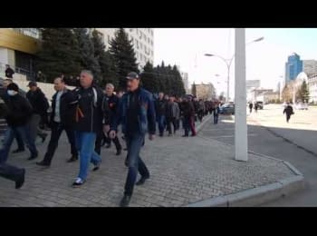 Lugansk, on April 8, 2014. Pro-Russian people goes towards the building of regional management of Security Service of Ukraine