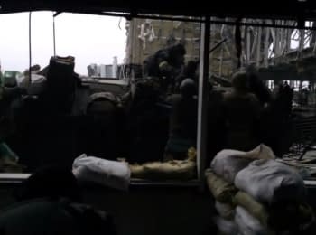 "Cyborgs" unloading the APC under fire at the Donetsk airport