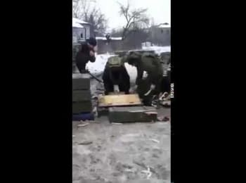 Chechen mercenaries firing from a mortar within a residential area
